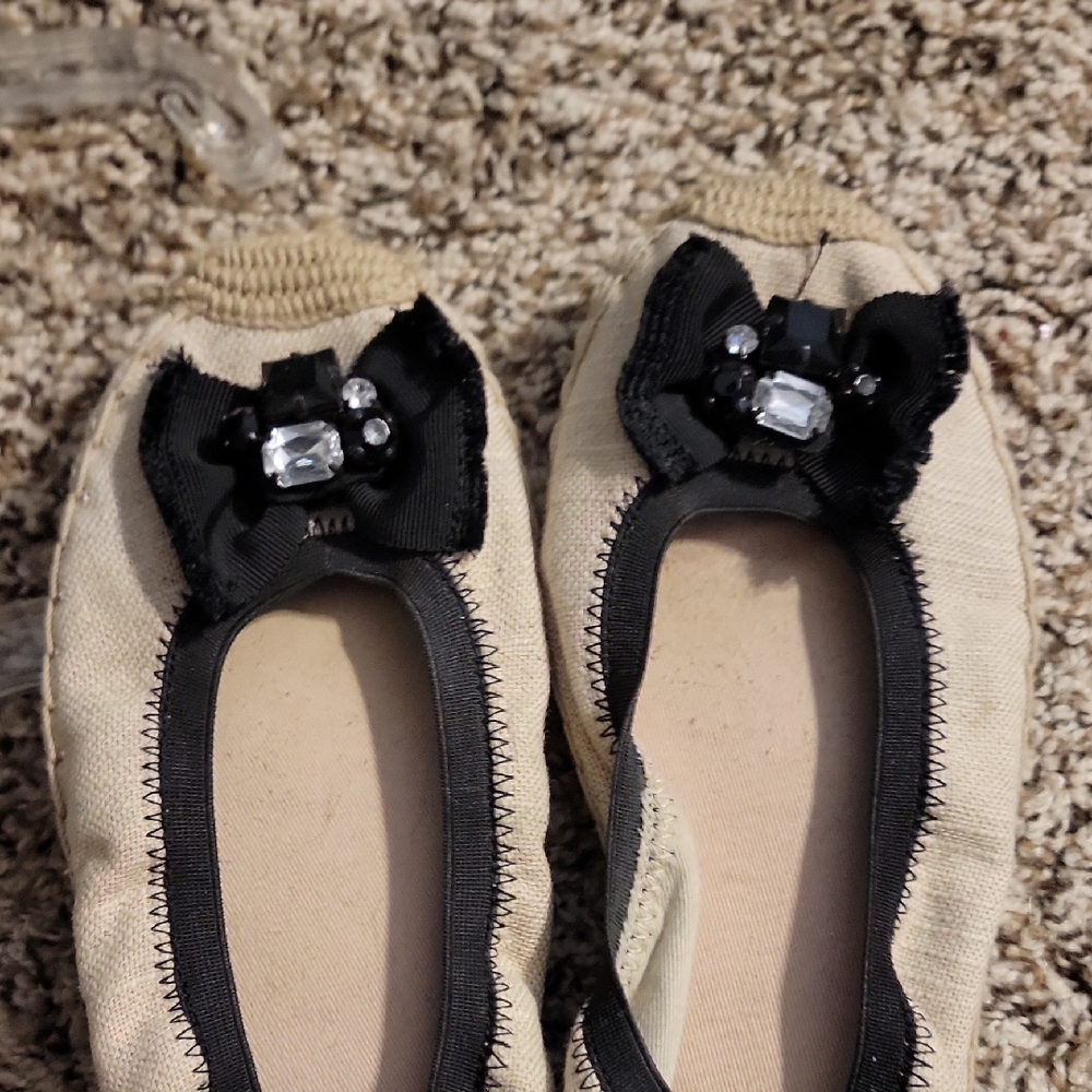 Beige Ballet Flats with Black Bow and Gem Accents